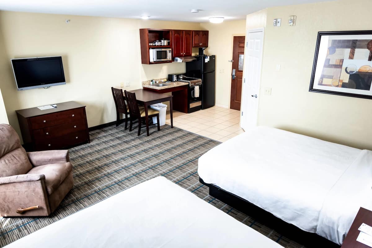 Pillowtop beds, desk, blackout drapes, iron/ironing board