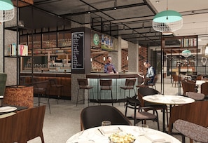 A modern bar area with a bartender, bar stools, and a menu board.