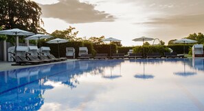 Indoor pool, outdoor pool, pool umbrellas, pool loungers