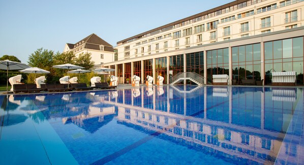 Indoor pool, outdoor pool, pool umbrellas, pool loungers