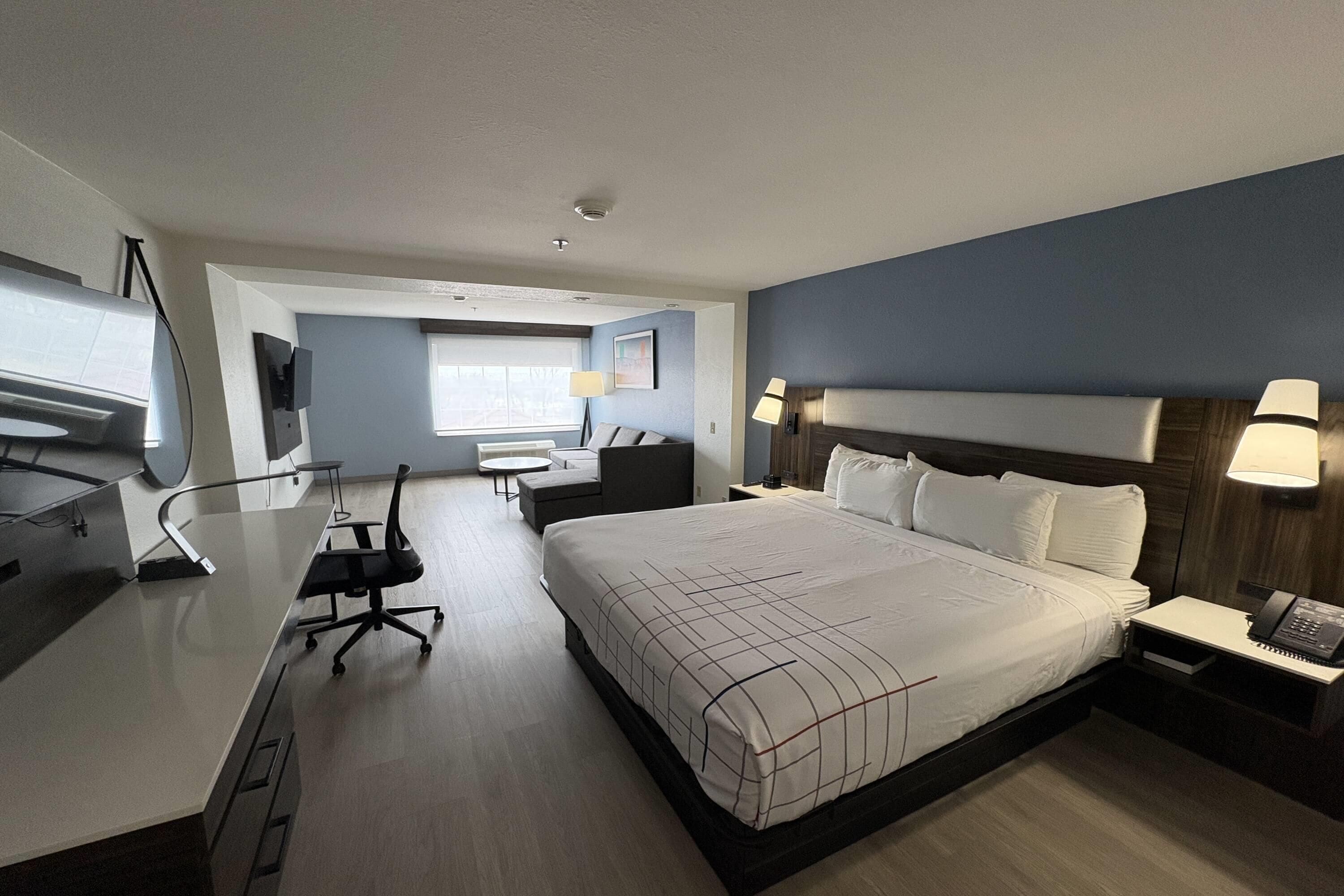Deluxe Suite, 1 King Bed, Non Smoking | Premium bedding, desk, blackout curtains, iron/ironing board