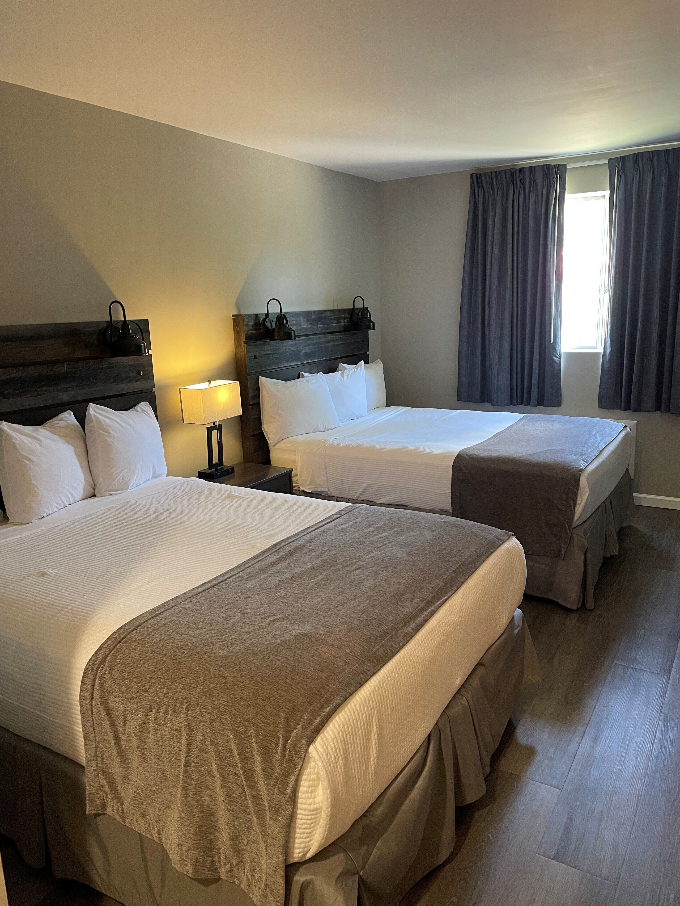 room, 2 queen beds | individually decorated, individually furnished, desk, laptop workspace