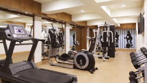 A gym with treadmills, elliptical machines, and free weights. - Lemon Tree Premier, Jaipur (Jaipur)