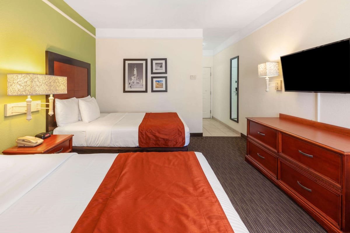 room, 2 double beds | premium bedding, in-room safe, desk, iron/ironing board