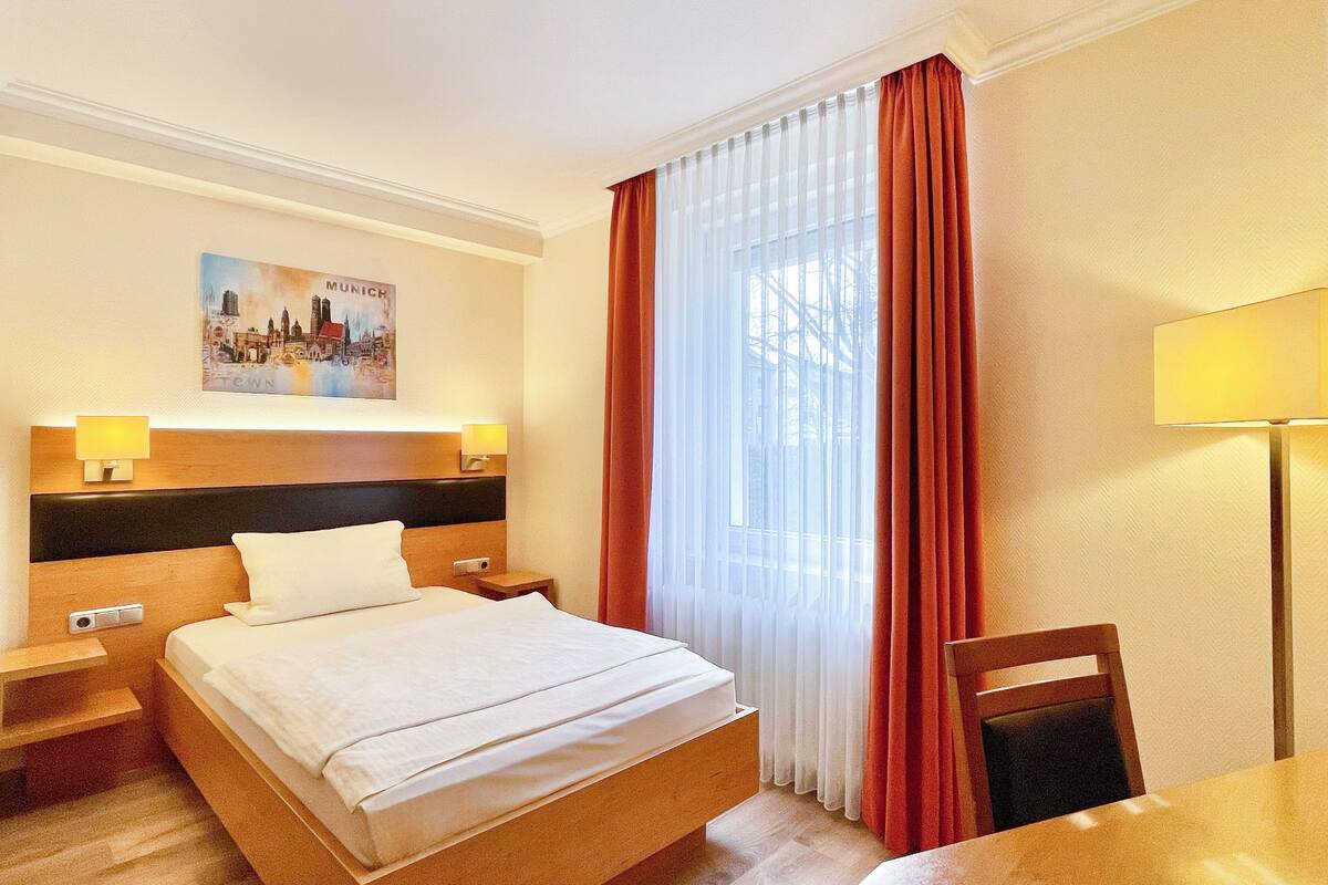 Habitación individual Confort | Colchones Select Comfort, minibar, escritorio y cortinas opacas