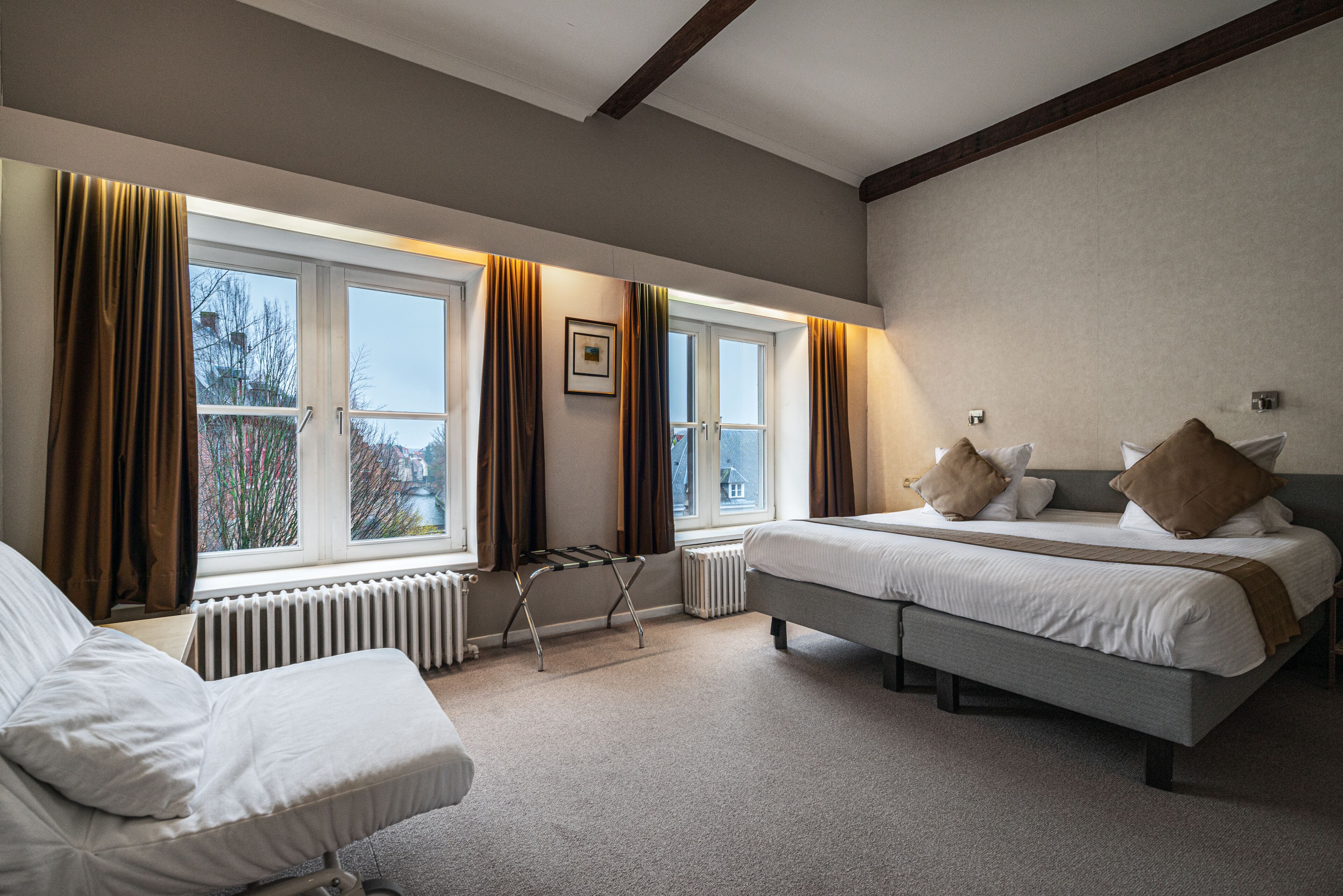 basic double or twin room, canal view | in-room safe, blackout curtains, cots/infant beds, free wifi