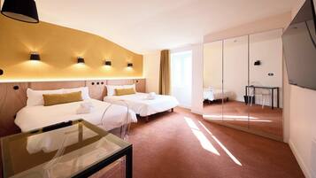 Premium bedding, desk, laptop workspace, blackout drapes