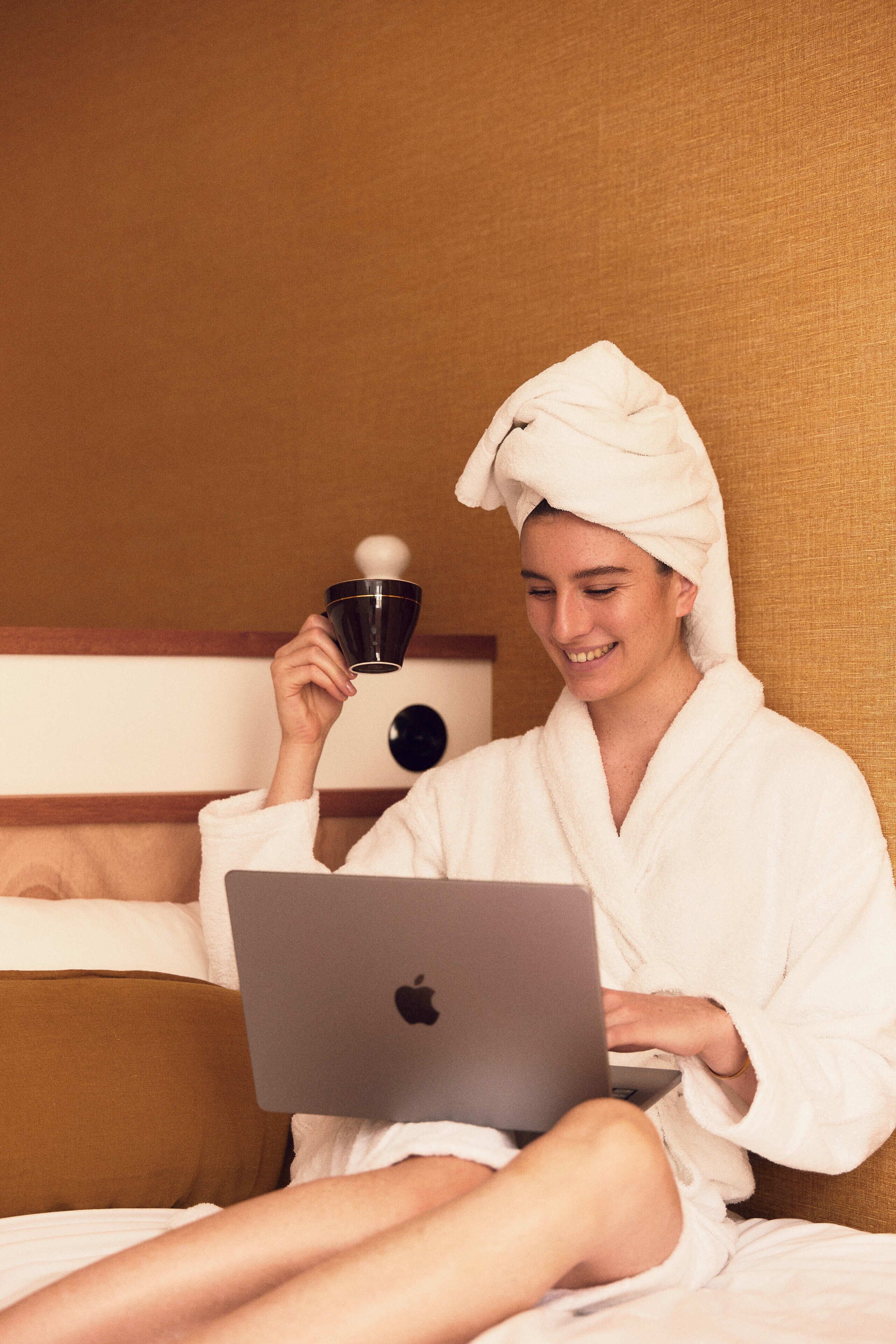 Premium bedding, desk, laptop workspace, blackout curtains