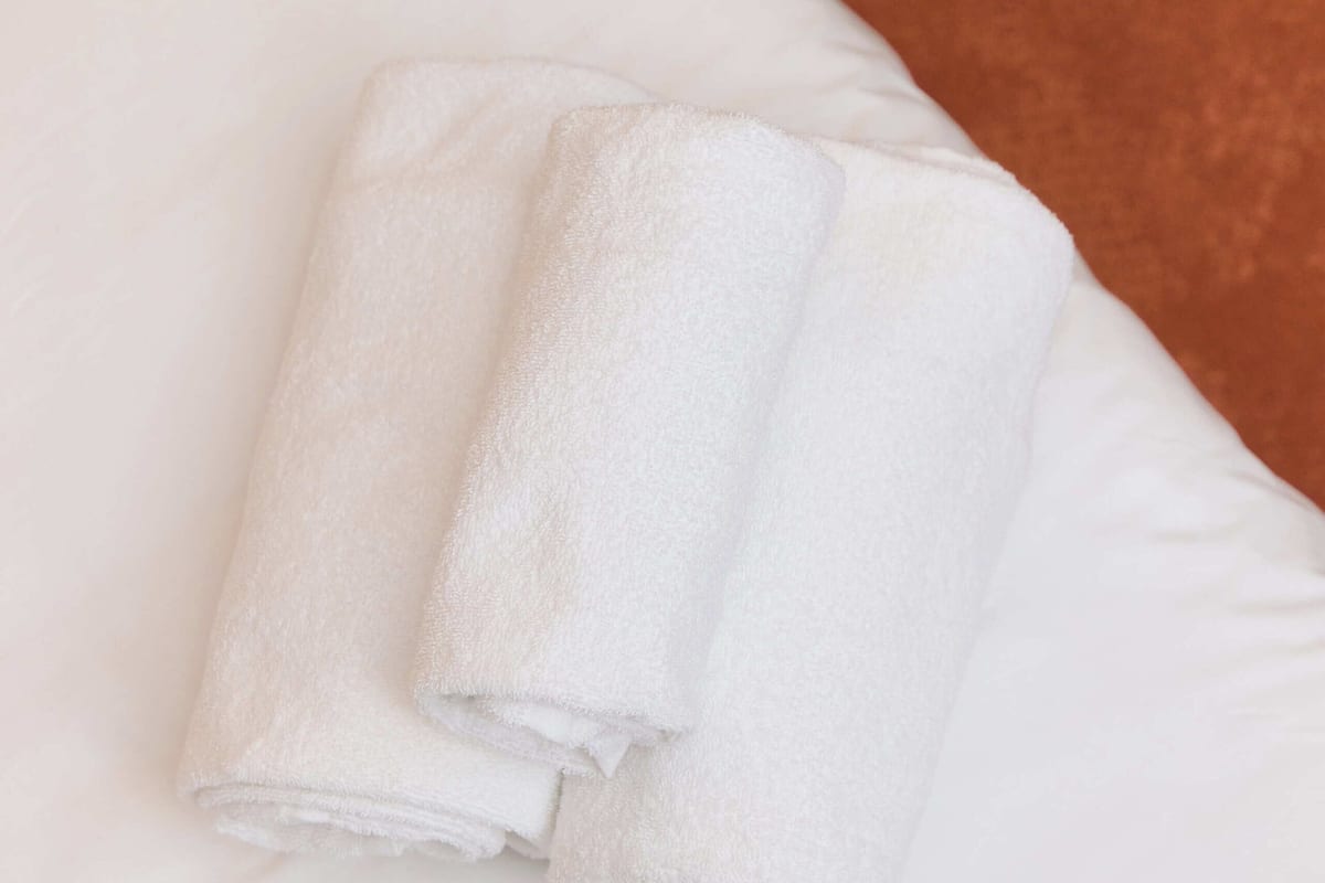 Premium bedding, desk, laptop workspace, blackout curtains