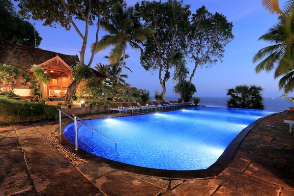 Outdoor pool, pool umbrellas - Somatheeram Ayurveda Village (Neyyattinkara)