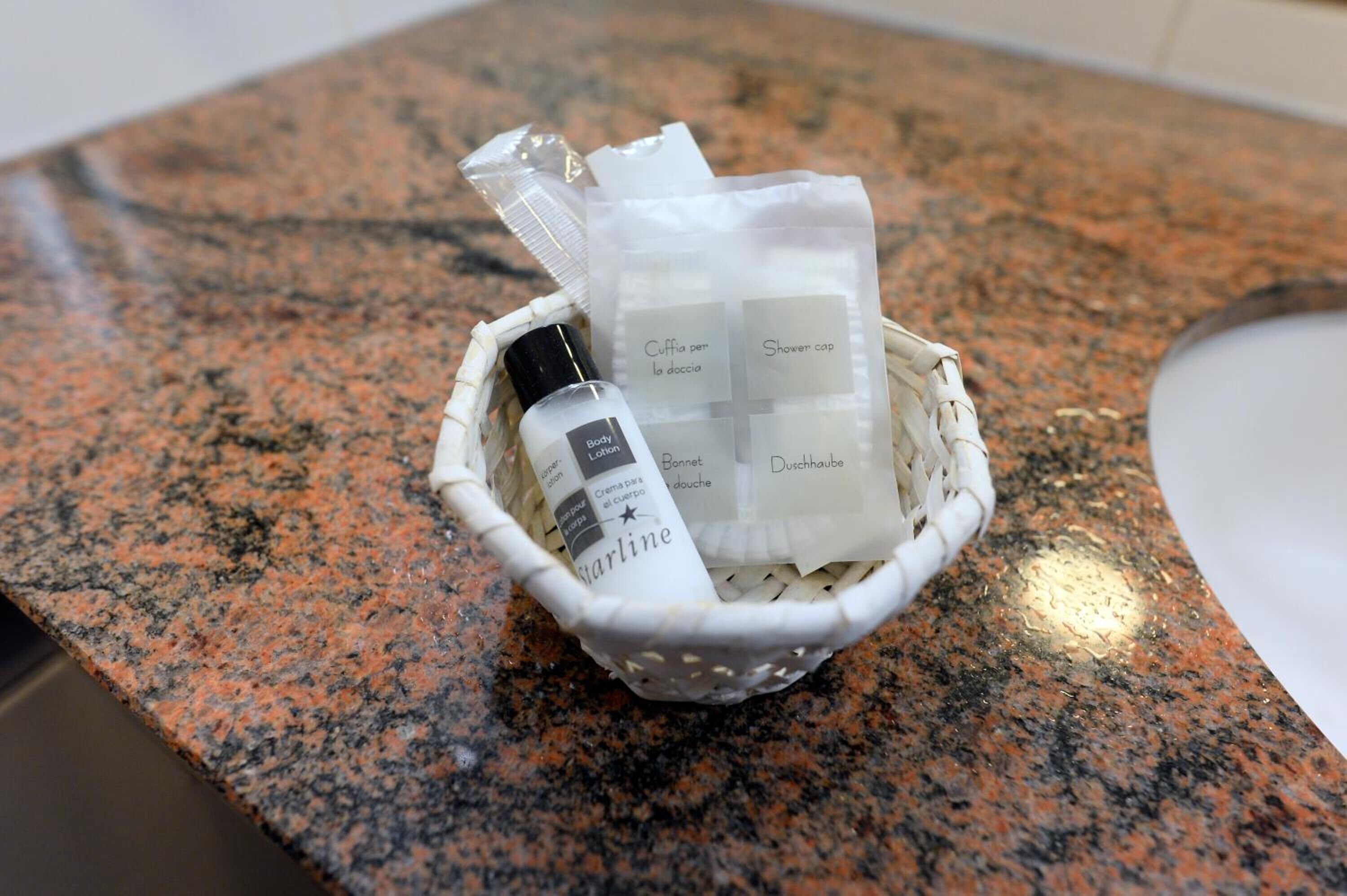 shower, hair dryer, slippers, towels