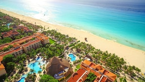 A resort with a large pool, beach, and ocean view. - Select Club at Sandos Playacar All Inclusive - Adults Only Area (Playa del Carmen)