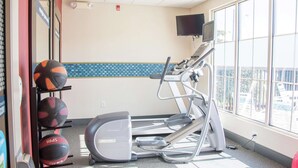 A gym with treadmills, a stationary bike, and a wall-mounted TV. - Hampton Inn Murphy (Murphy)