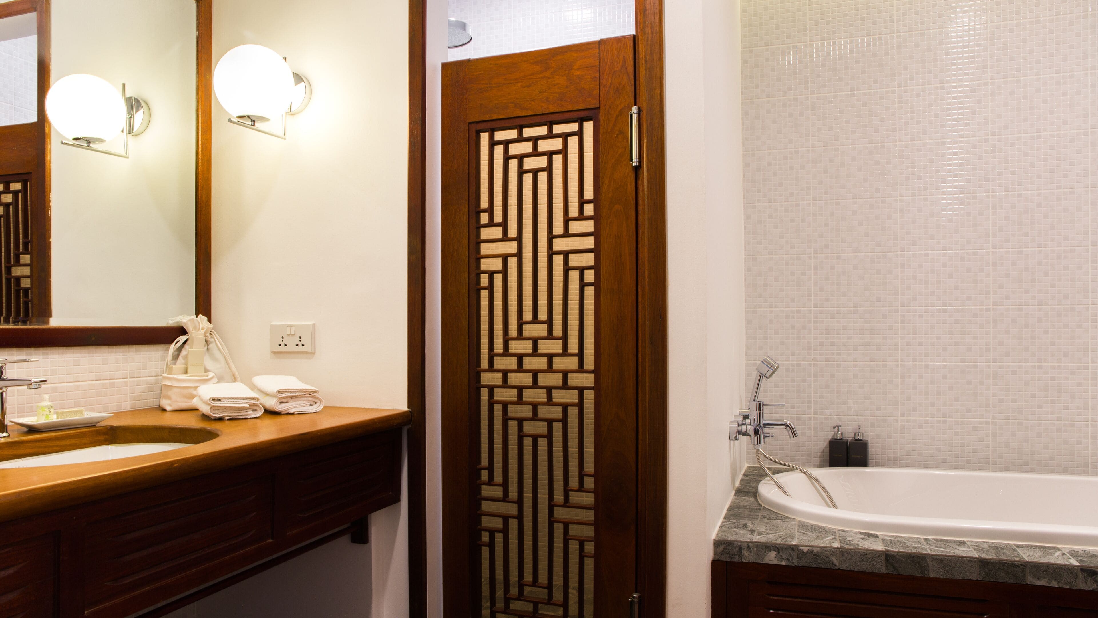 junior suite | bathroom | separate bathtub and shower, deep-soaking bathtub, rainfall showerhead