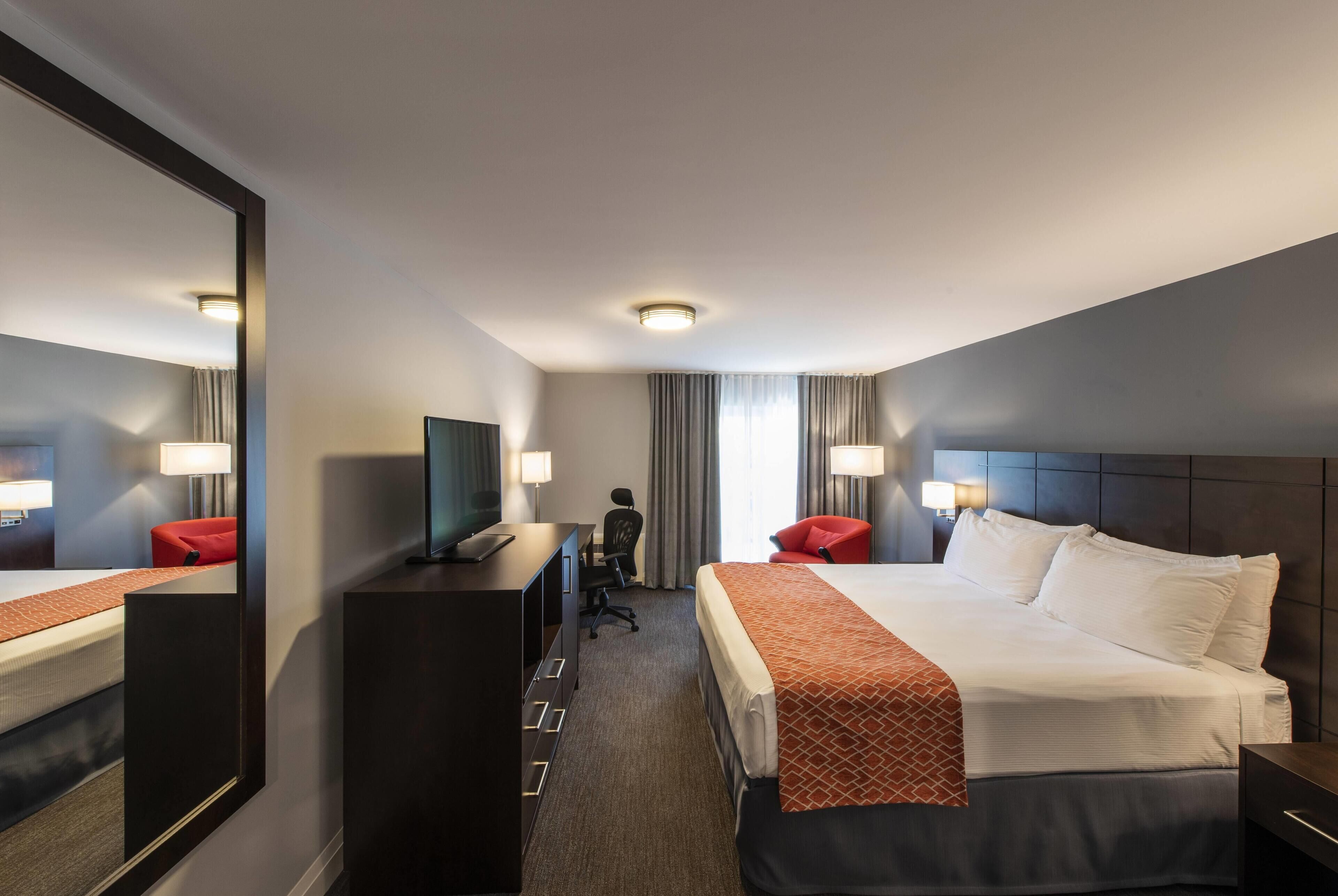 Habitación Deluxe, 1 cama King size, para no fumadores | Cortinas blackout, tabla de planchar con plancha y cunas gratuitas 