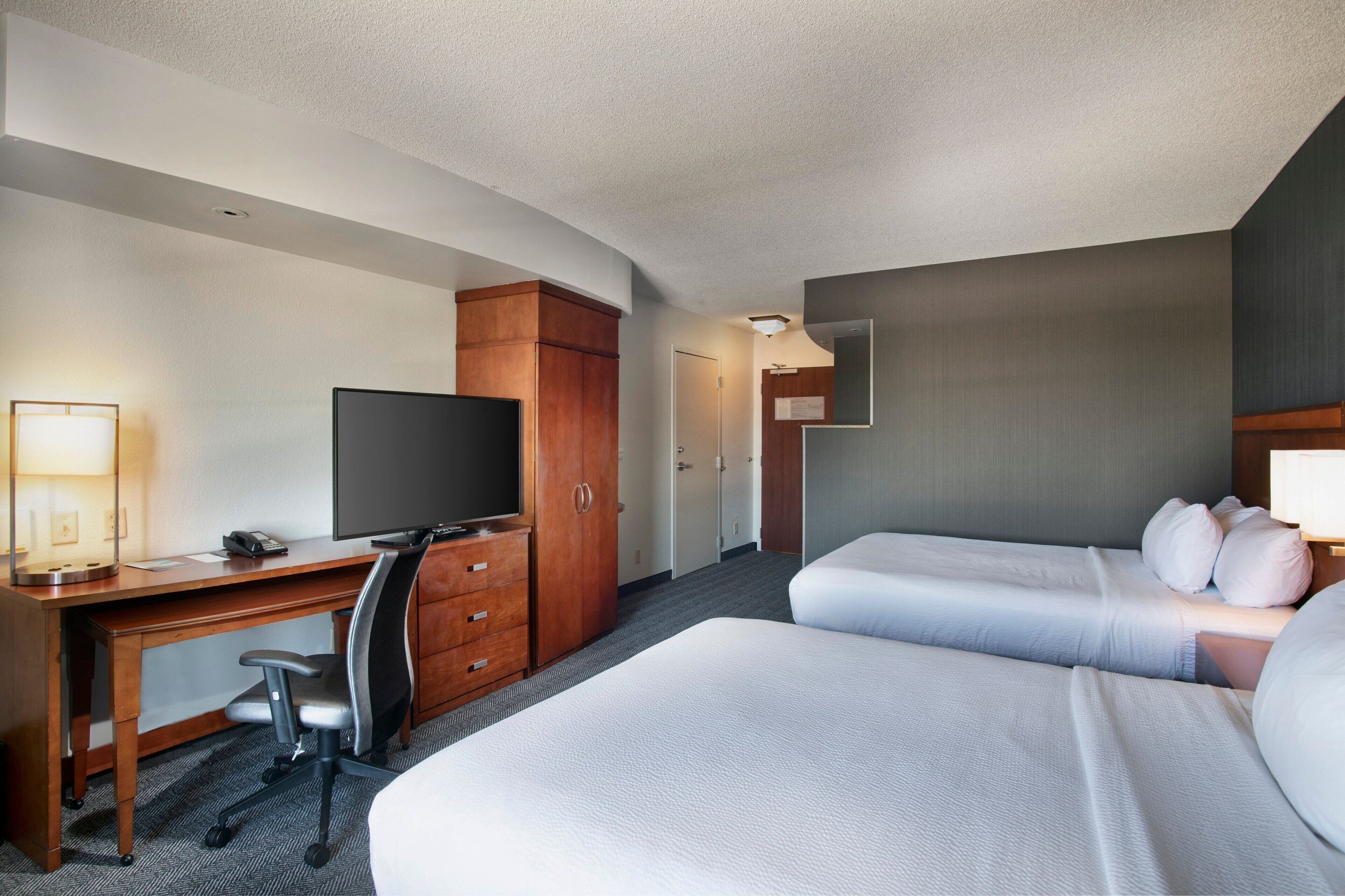 premium bedding, desk, blackout curtains, iron/ironing board