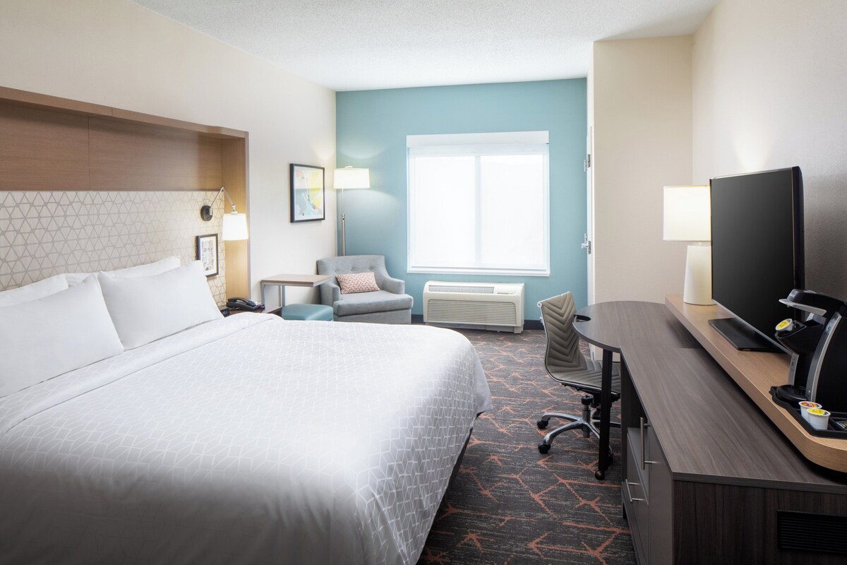 Premium bedding, desk, laptop workspace, iron/ironing board