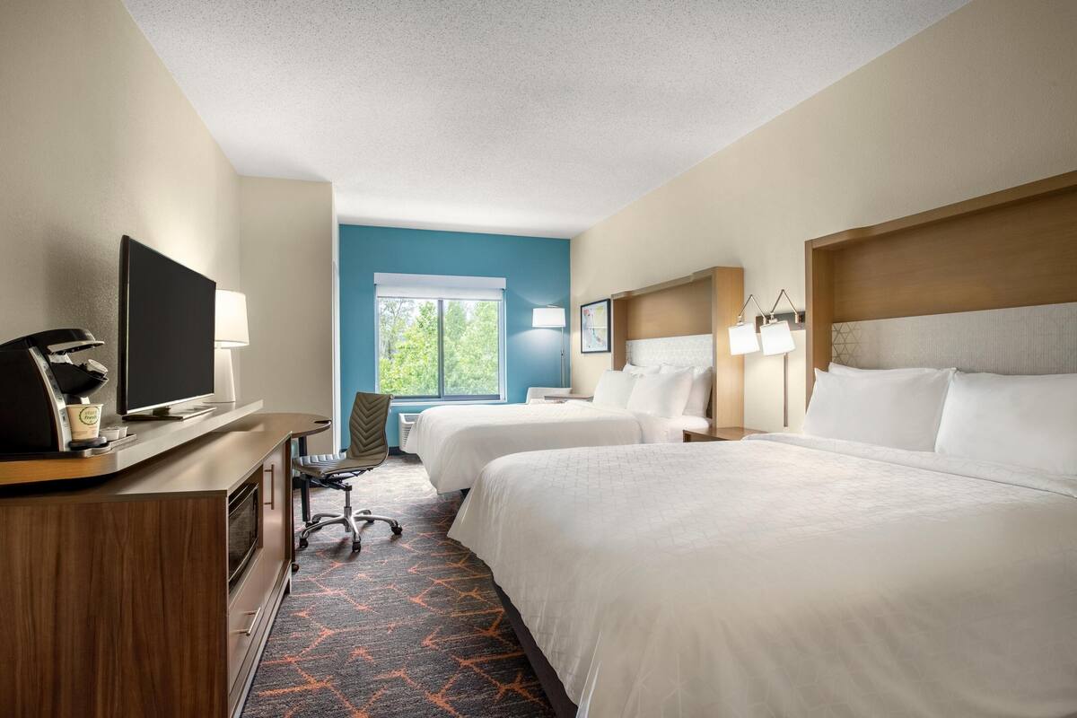 Premium bedding, desk, laptop workspace, iron/ironing board