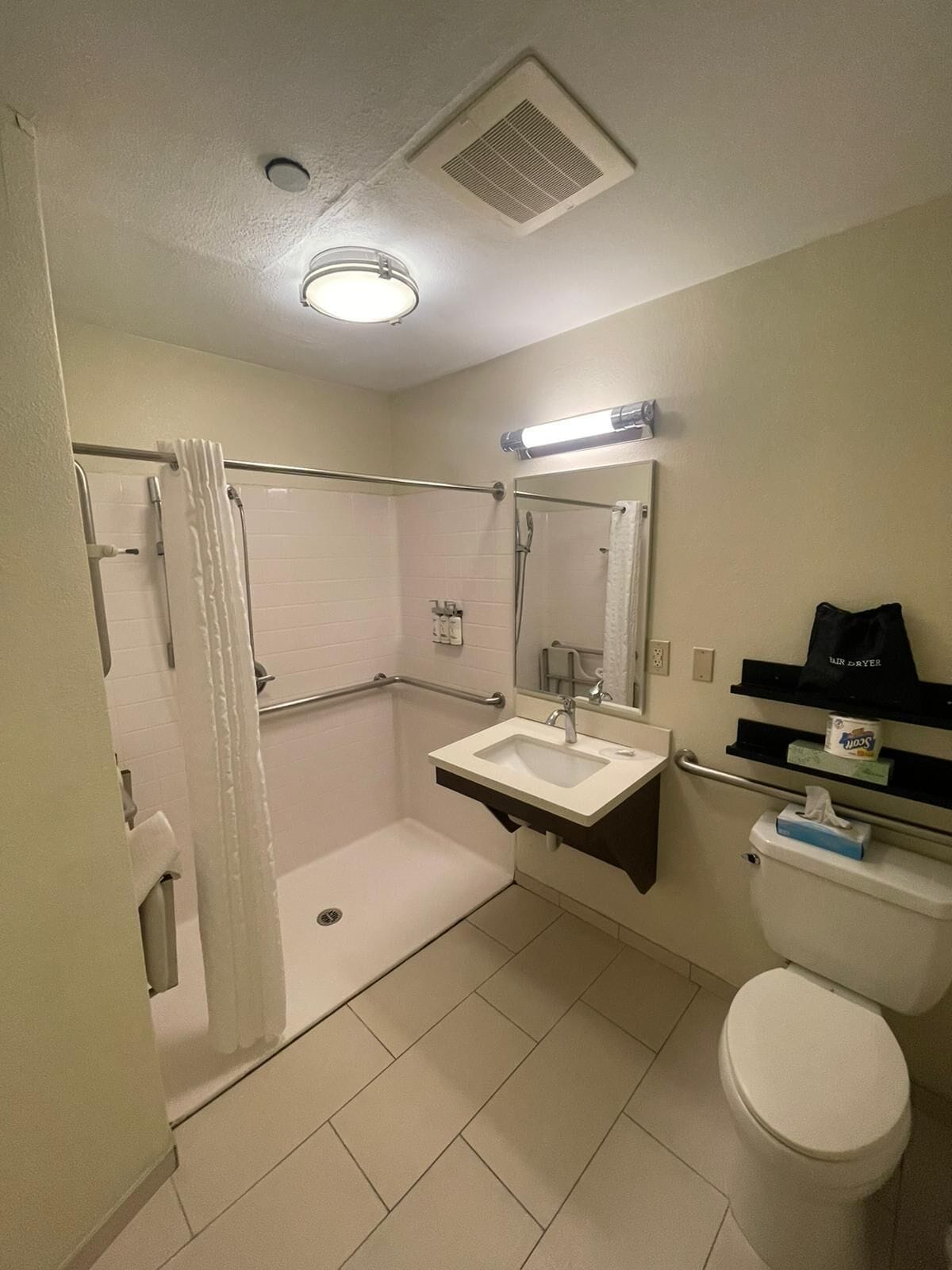 combined shower/bathtub, free toiletries, hair dryer, towels