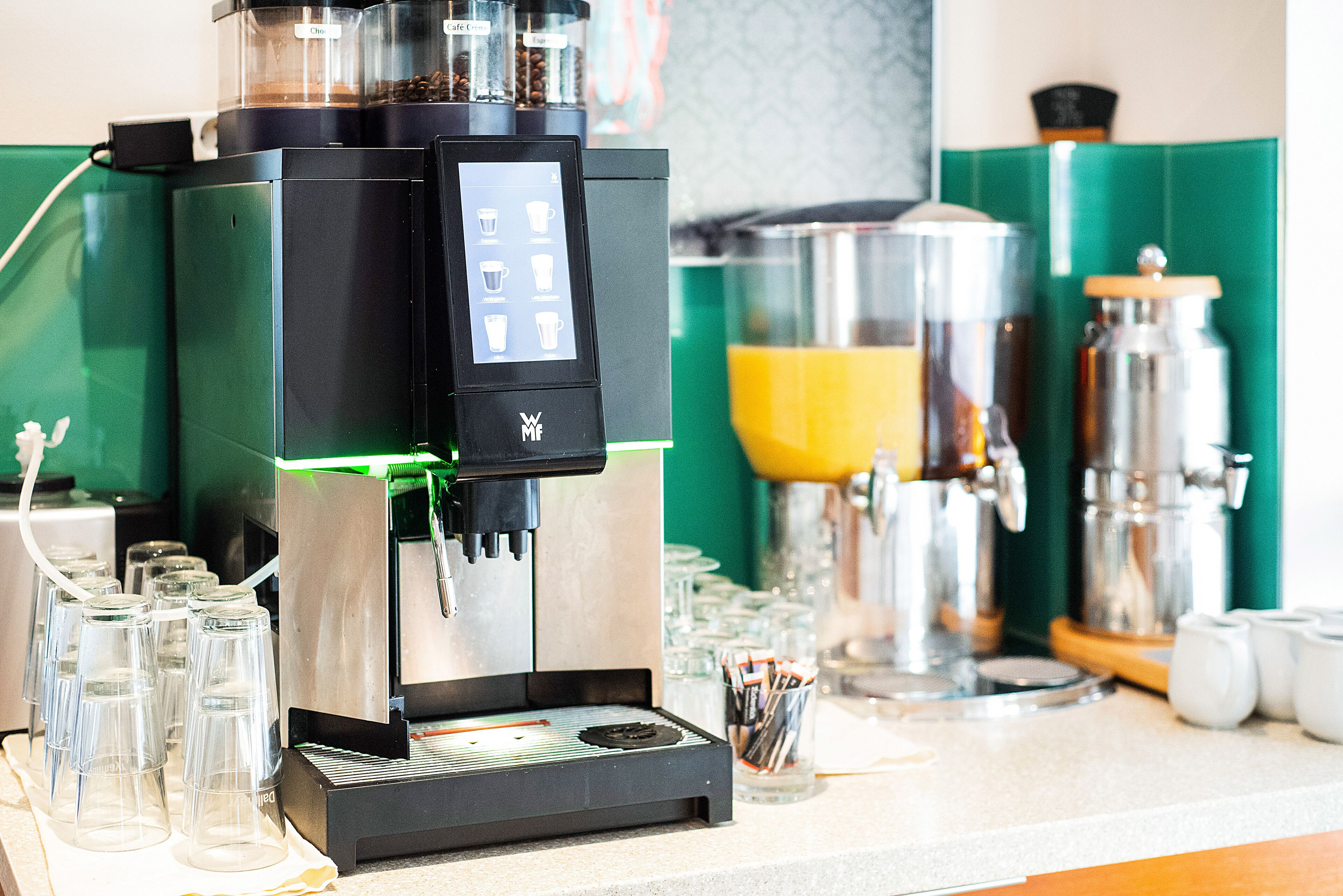 A coffee machine with a digital display, a grinder, and a milk frother.