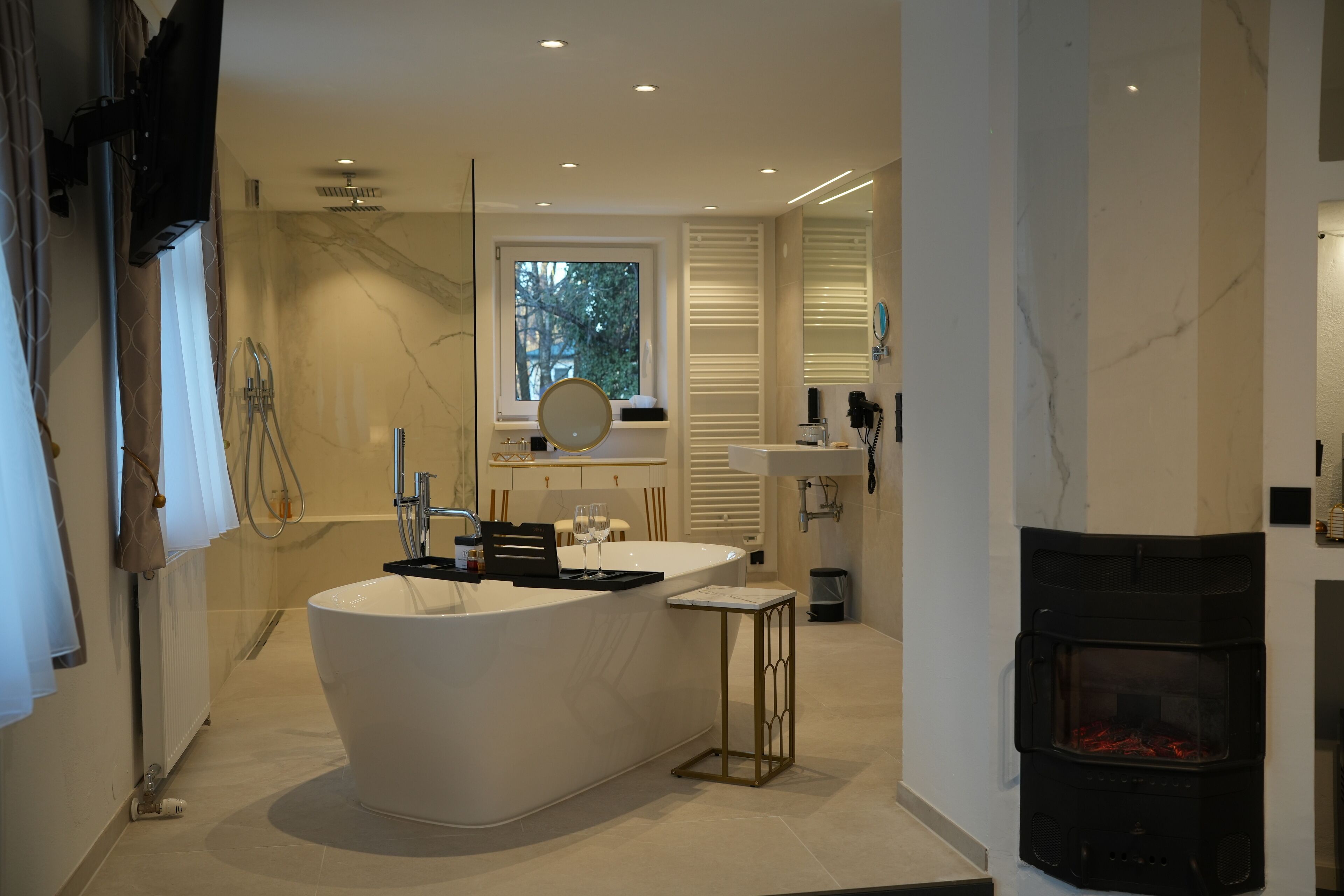 deluxe studio suite, 1 king bed | bathroom | hair dryer, towels