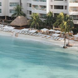 On the beach, white sand, sun loungers, beach umbrellas