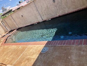 Outdoor pool, open 8:00 AM to 10:00 PM, pool loungers