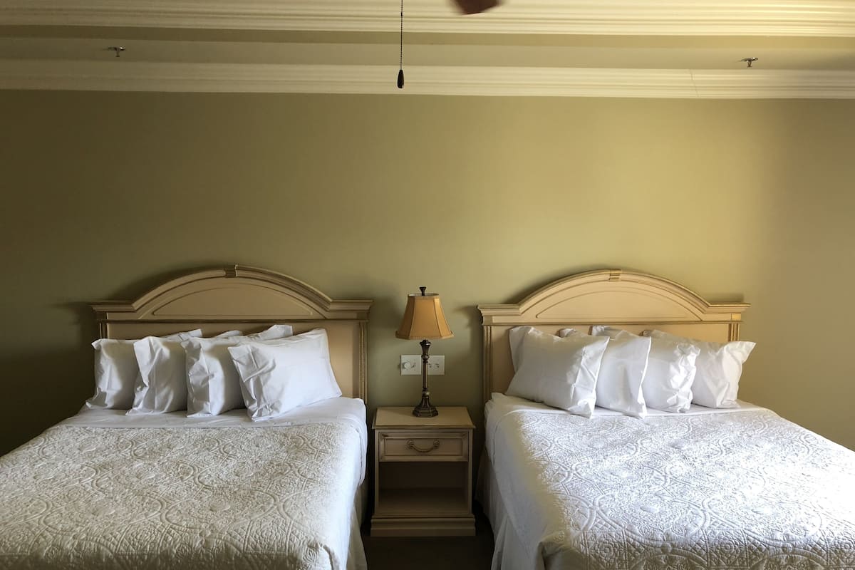 Standard Room, 2 Queen Beds, Non Smoking | Pillowtop beds, desk, blackout drapes, iron/ironing board