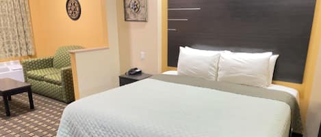 Chambre Deluxe, 1 trĂšs grand lit, non-fumeur | Fer et planche Ă repasser, accĂšs au Wi-Fi (inclus), literie fournie