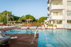 Indoor pool, outdoor pool, pool umbrellas