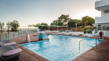 Indoor pool, outdoor pool, pool umbrellas