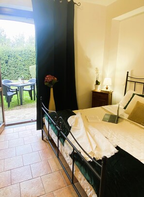 Enjoy a peaceful retreat with a garden view, a comfortable workspace, and a touch of greenery.