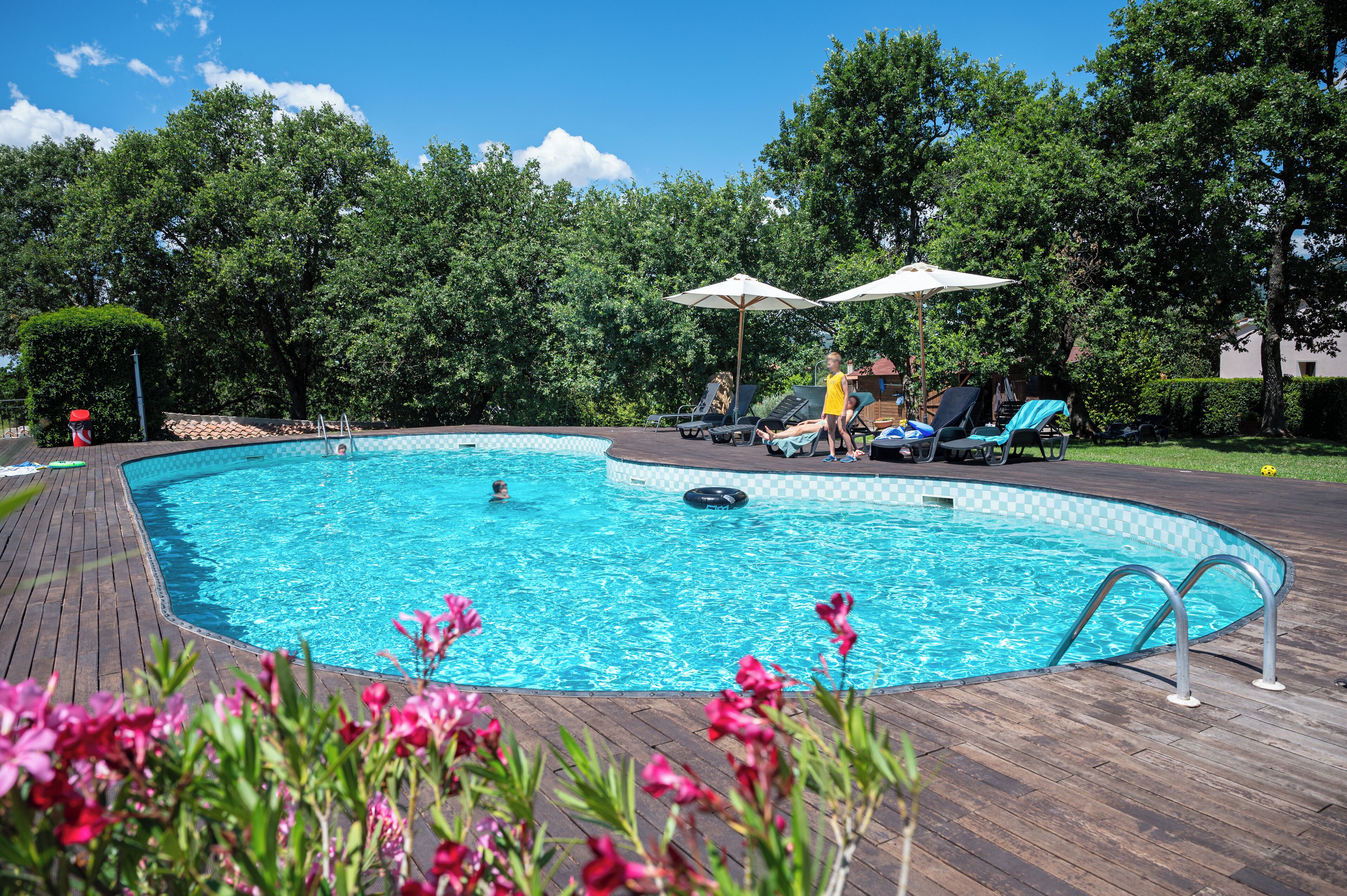 Seasonal outdoor pool, open 8:30 AM to 8:00 PM, pool umbrellas
