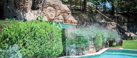 Seasonal outdoor pool, open 8:30 AM to 8:00 PM, pool umbrellas