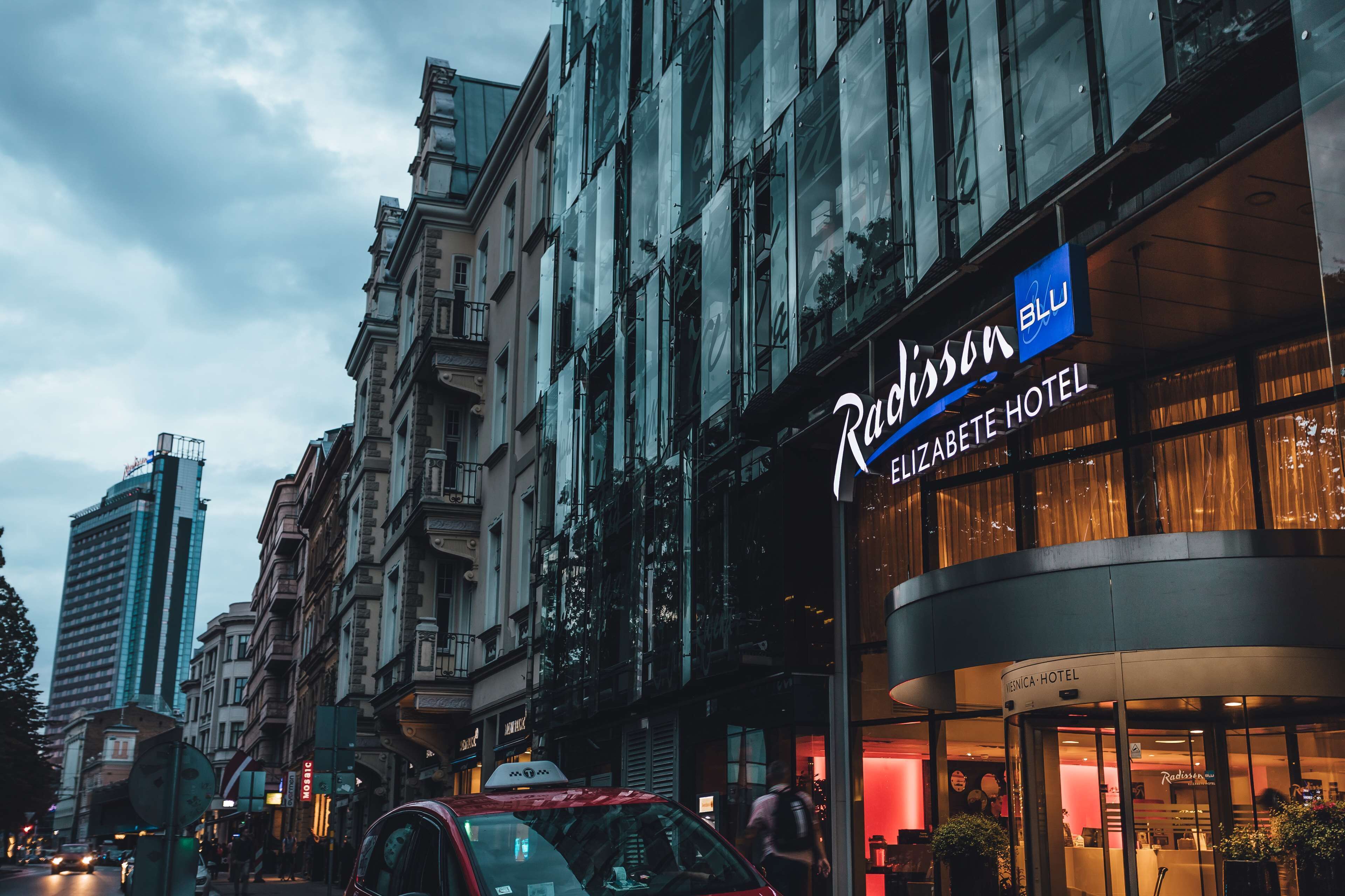 A hotel entrance with a sign for Radisson Blu.