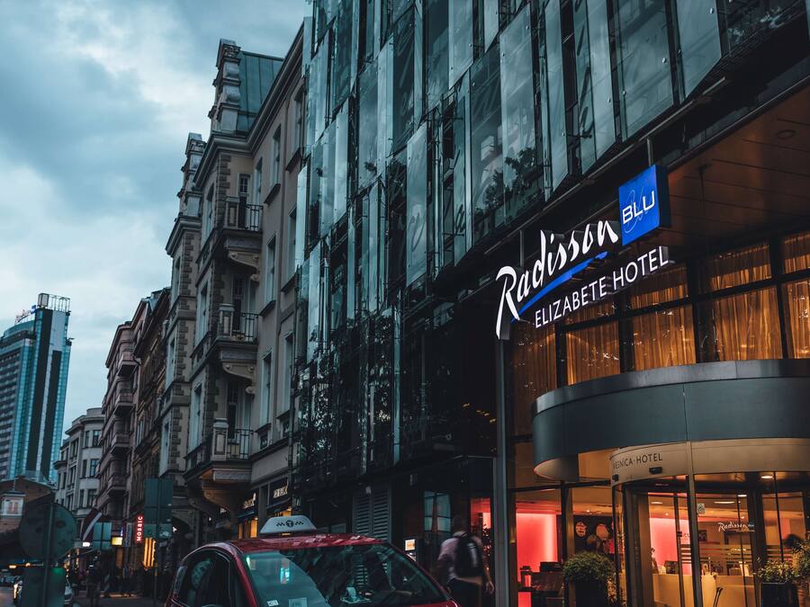 A hotel entrance with a sign for Radisson Blu.