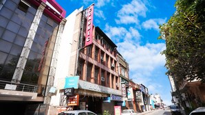 A hotel named 'Hotel Classic' with a signboard, a visible entrance, and a parked car in front. - Hotel Classic Karol Bagh (New Delhi)
