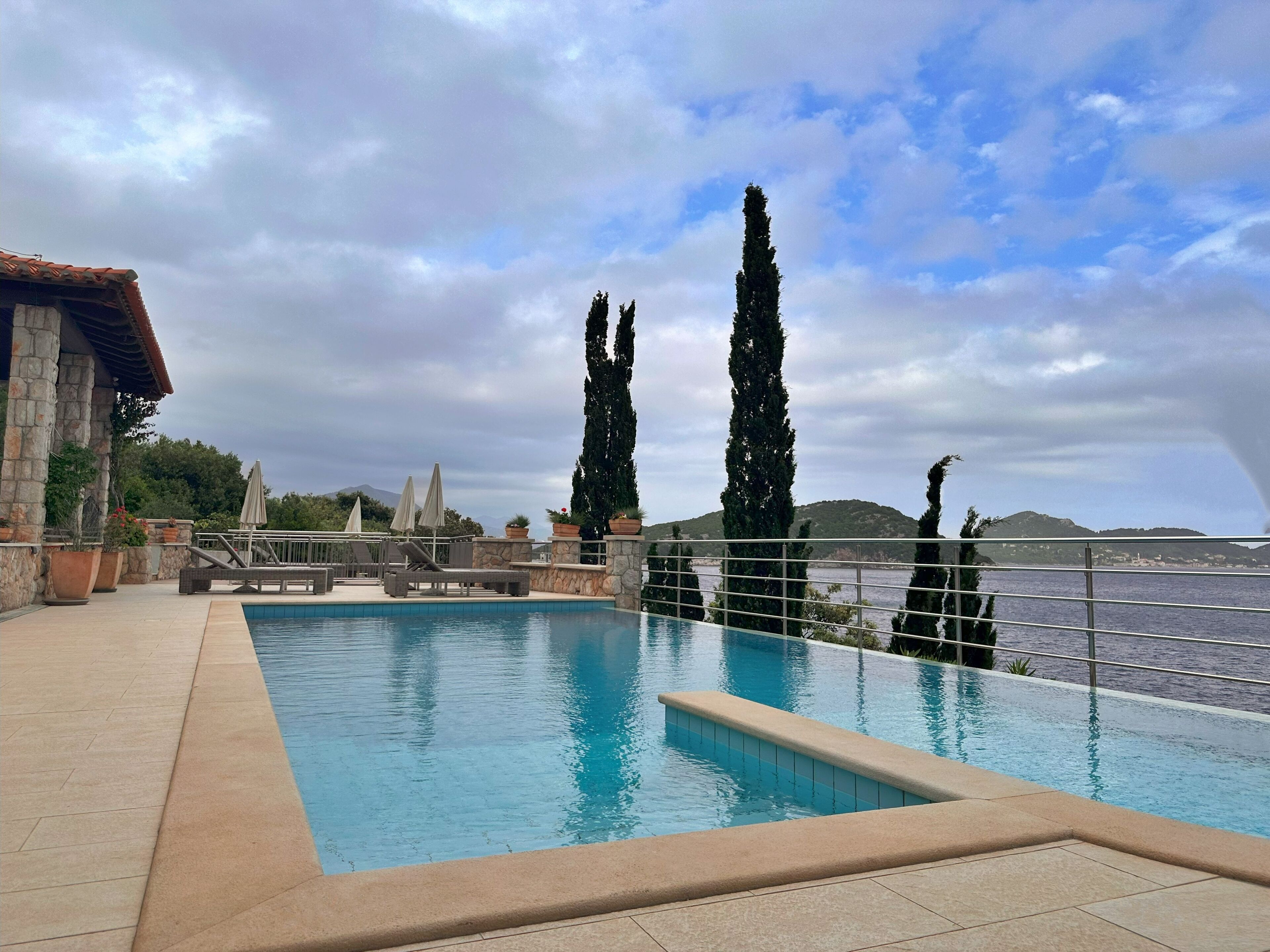 outdoor pool, open 10:00 am to 7:00 pm, pool umbrellas, pool loungers