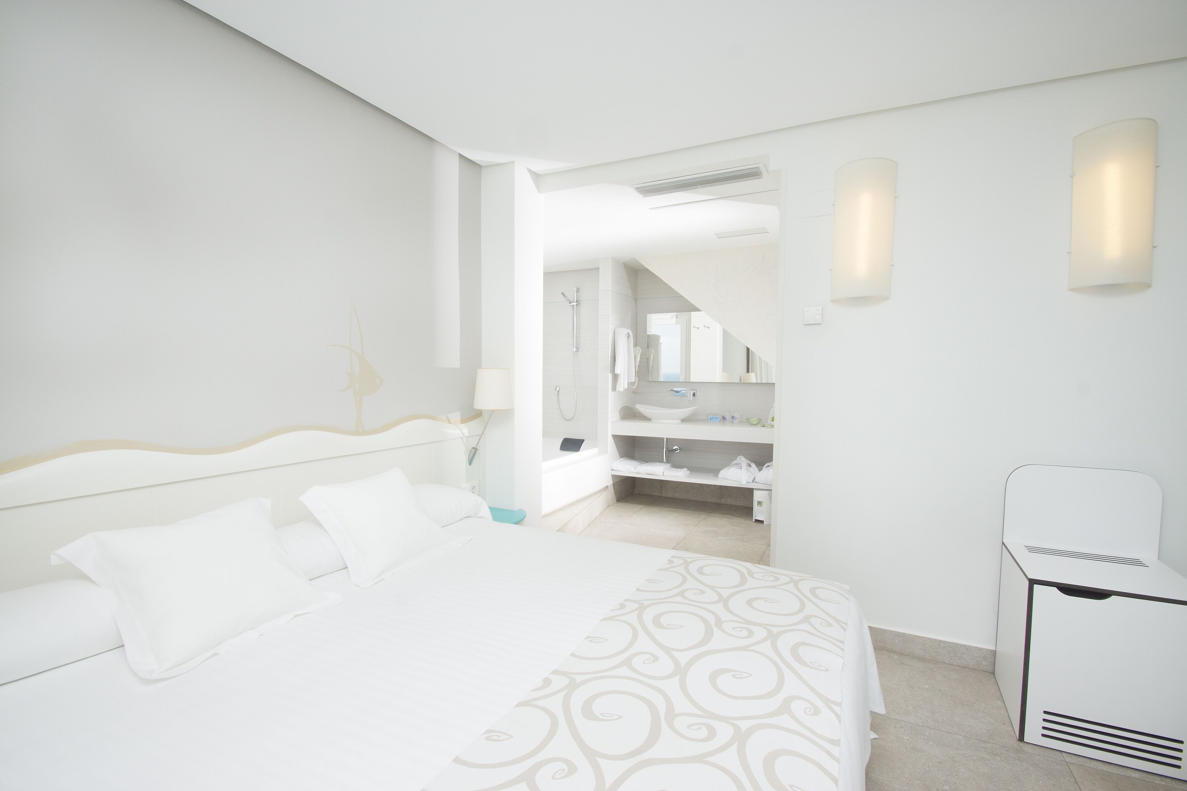junior studio suite, sea view | in-room safe, desk, blackout curtains, iron/ironing board