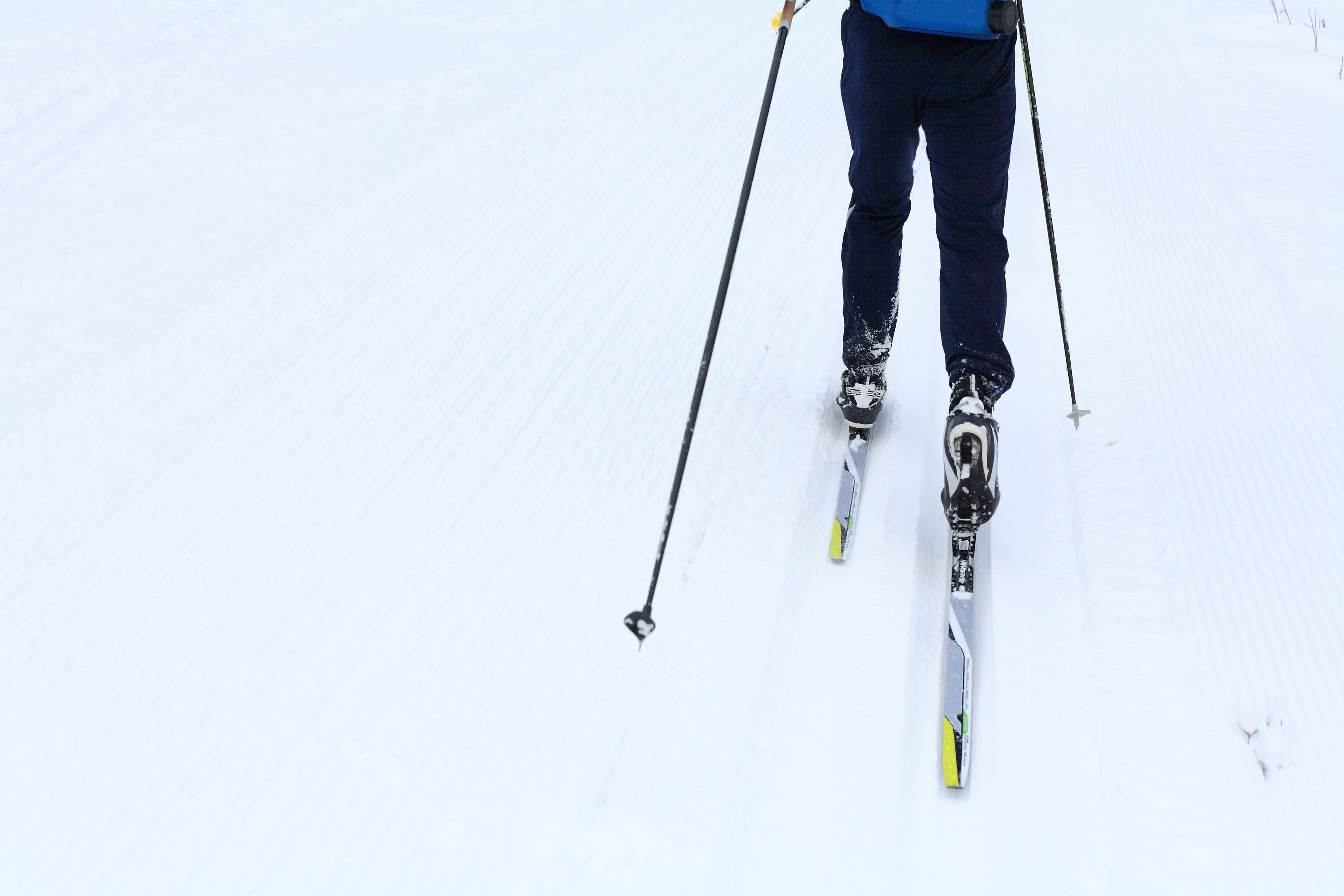 A person skiing down a snowy slope.