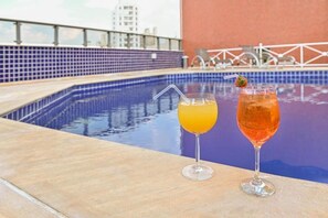 Outdoor pool, pool umbrellas, sun loungers