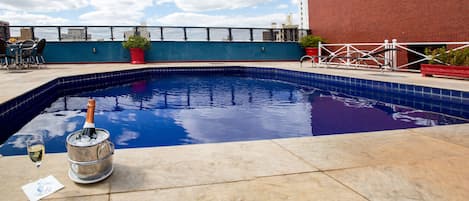 Outdoor pool, pool umbrellas, sun loungers