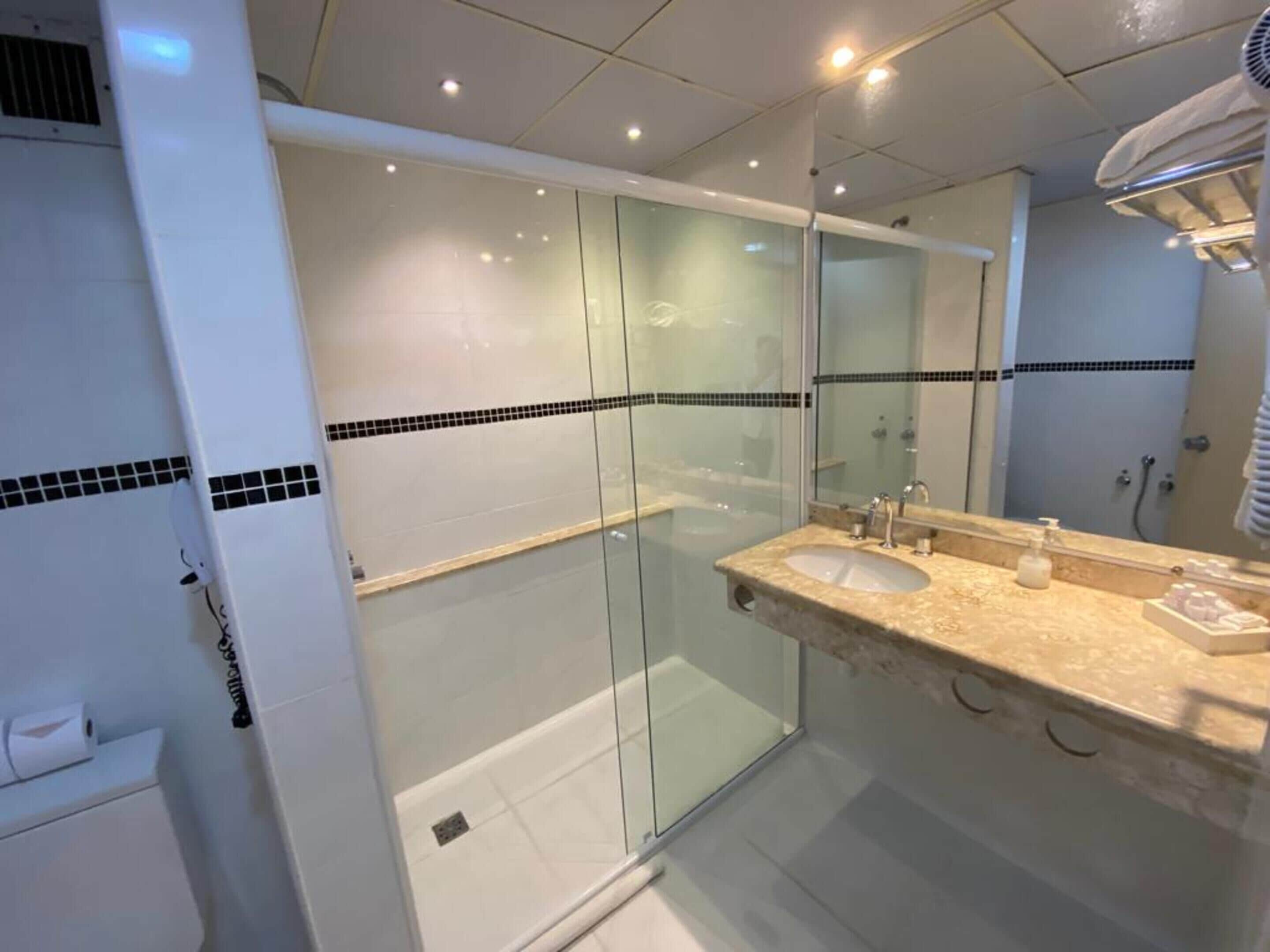 superior quadruple room | bathroom | shower, free toiletries, hair dryer, towels