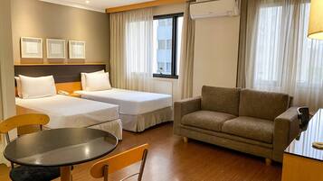 Standard Twin Room | Minibar, in-room safe, desk, laptop workspace