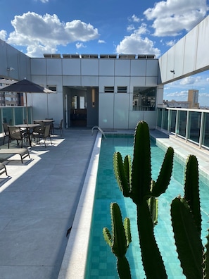 Outdoor pool, pool umbrellas, sun loungers