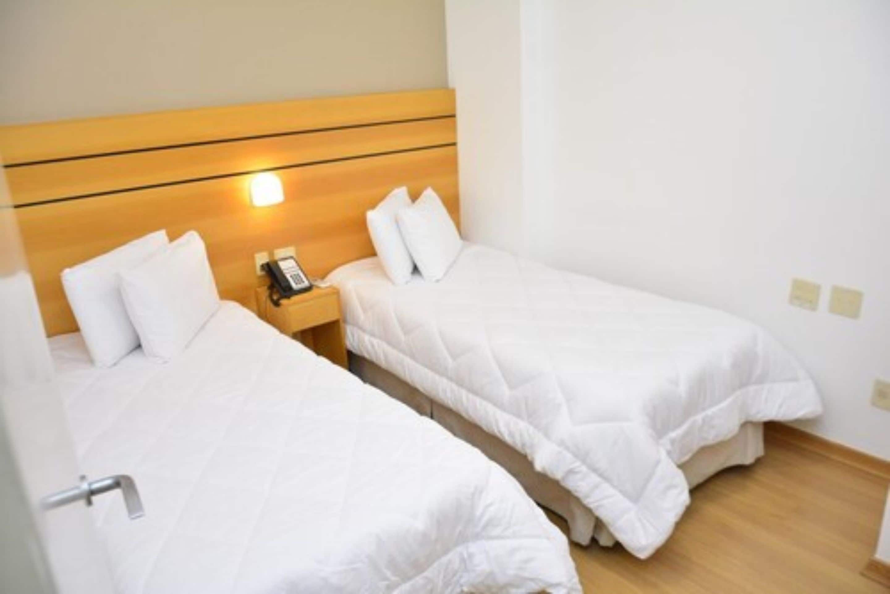 deluxe single room | minibar, in-room safe, blackout curtains, free wifi