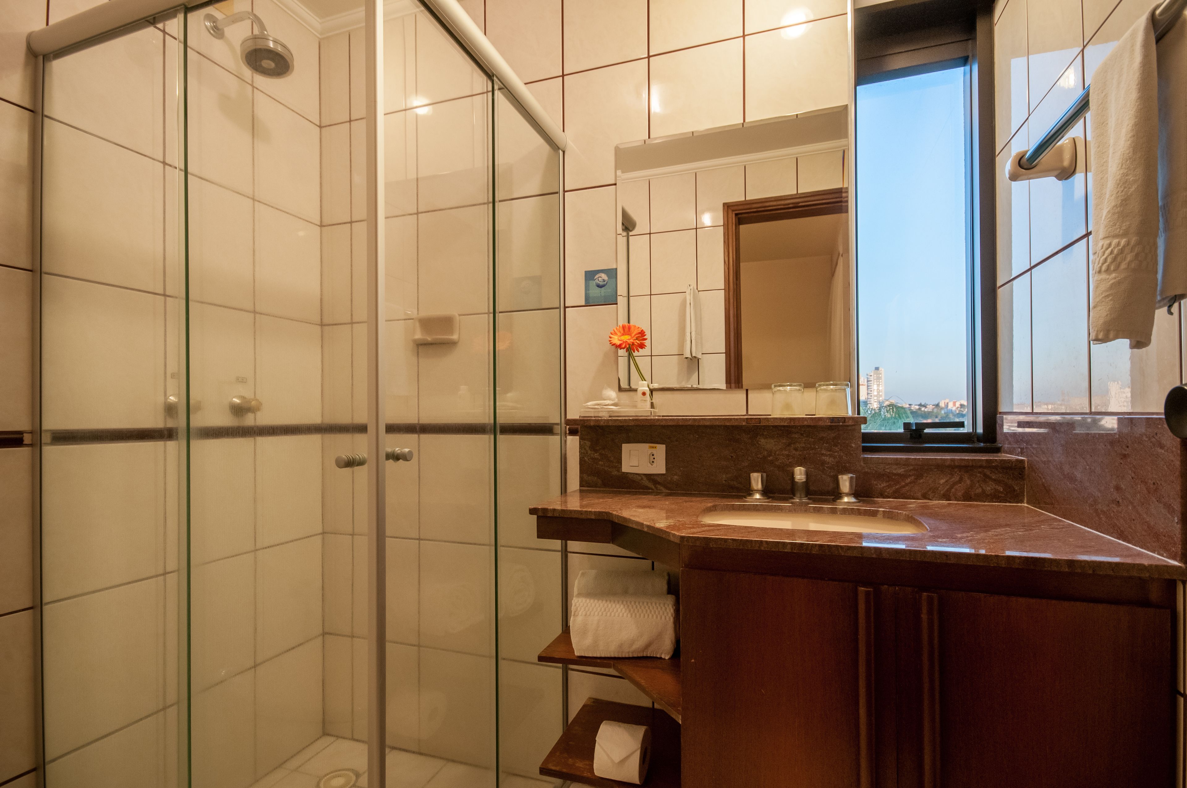 luxury room, multiple beds | bathroom | shower, rainfall showerhead, towels, soap