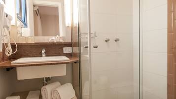 Shower, rainfall showerhead, towels, soap