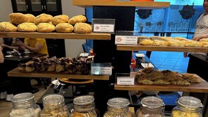 A bakery display with various pastries and spreads. - Hotel Saint Paul (São José do Rio Preto)