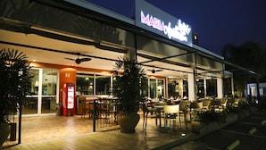 A modern building with a sign reading "MARIA".